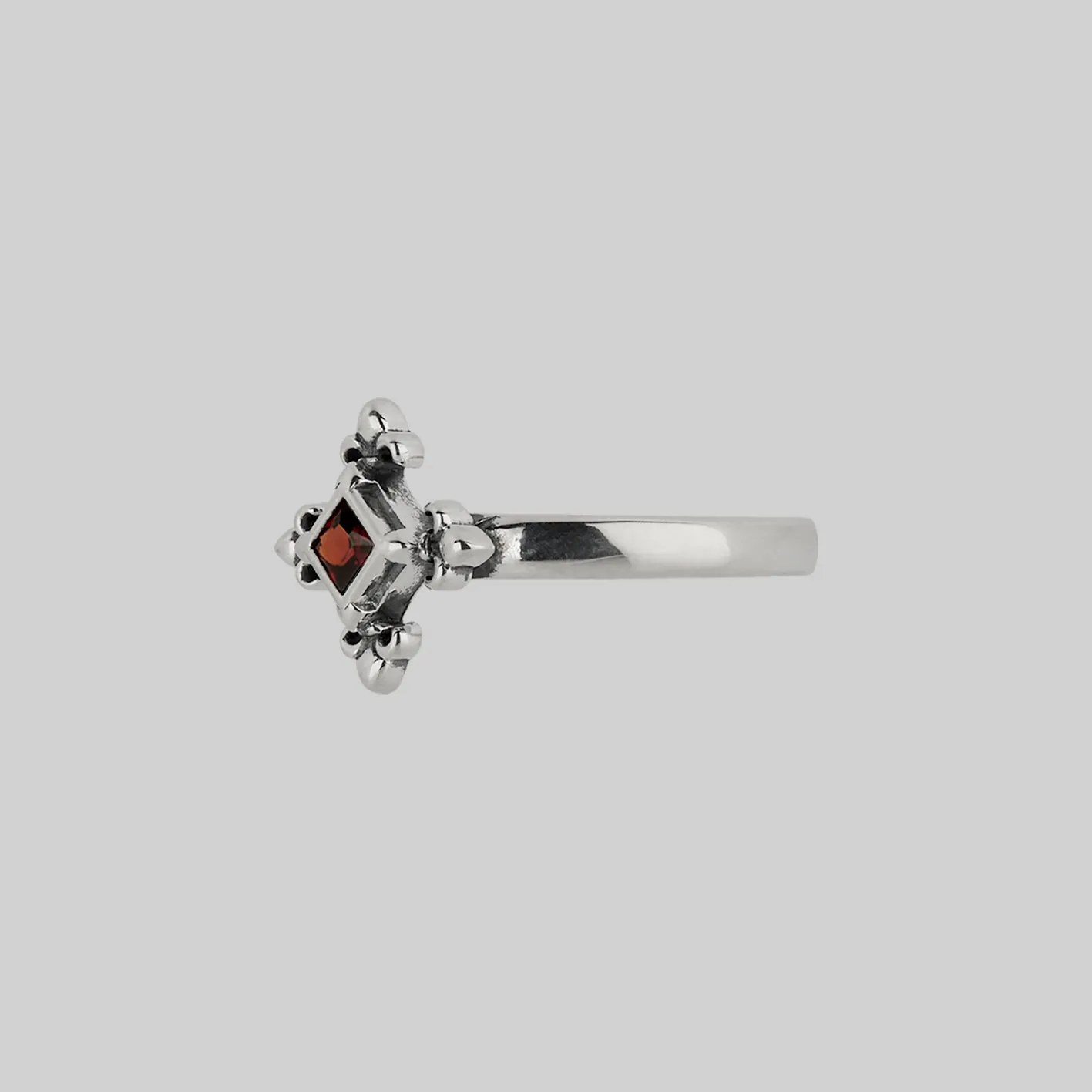 CRIMSON. Medieval Fleur de Lis Garnet Ring - Silver